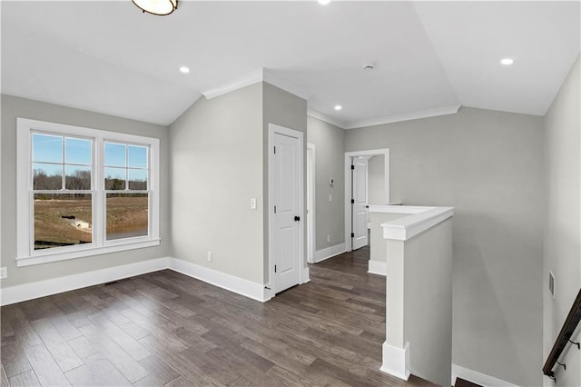 interior space with crown molding, lofted ceiling, recessed lighting, dark wood-type flooring, and baseboards