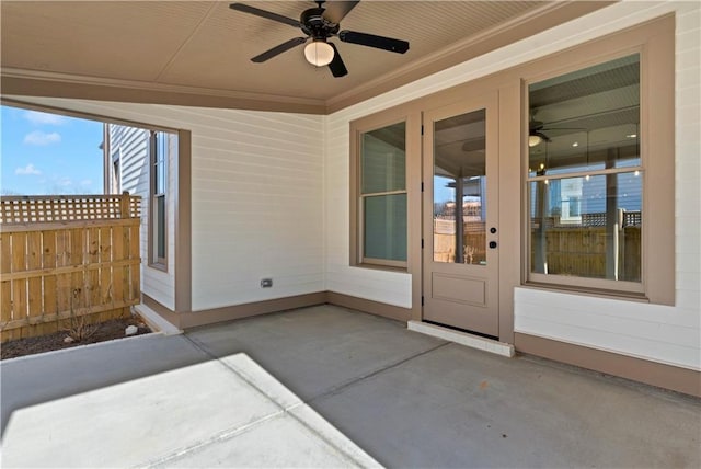 view of patio / terrace with fence and a ceiling fan