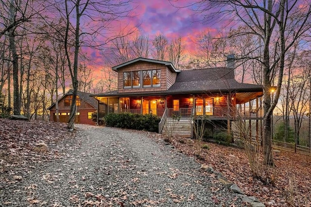 log-style house with a porch