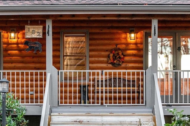 doorway to property featuring covered porch