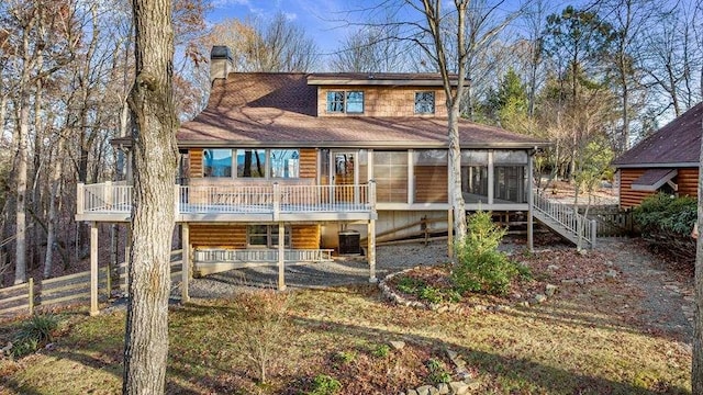 view of front of house with a sunroom and cooling unit