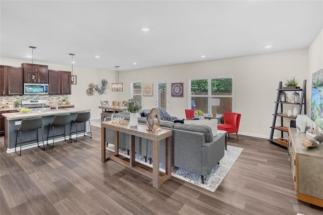 104 Auburn Crossing Way, Auburn, GA 30011 - living area with dark wood-style flooring, recessed lighting, and baseboards