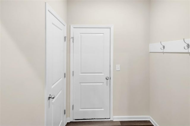 104 Auburn Crossing Way, Auburn, GA 30011 - laundry room with baseboards and wood finished floors