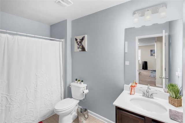 104 Auburn Crossing Way, Auburn, GA 30011 - full bath featuring vanity, toilet, a shower with shower curtain, and baseboards