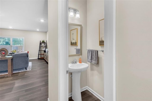 104 Auburn Crossing Way, Auburn, GA 30011 - bathroom with wood finished floors, baseboards, recessed lighting, and a sink