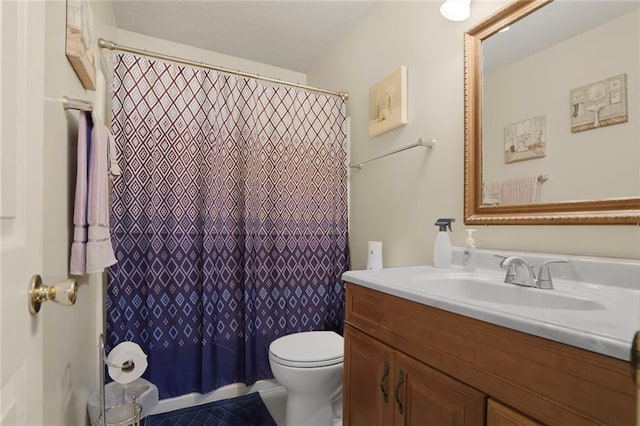 bathroom featuring a shower with curtain, vanity, and toilet