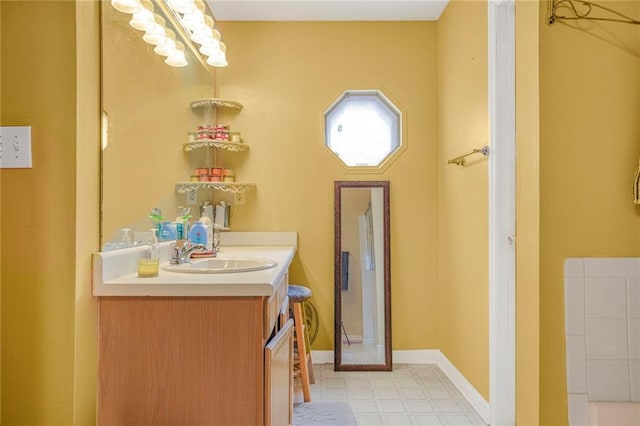 bathroom featuring baseboards, vanity, and tile patterned floors