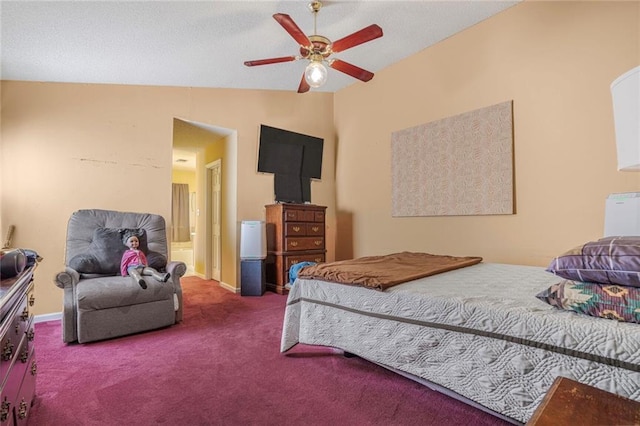 carpeted bedroom with lofted ceiling, ensuite bath, and ceiling fan