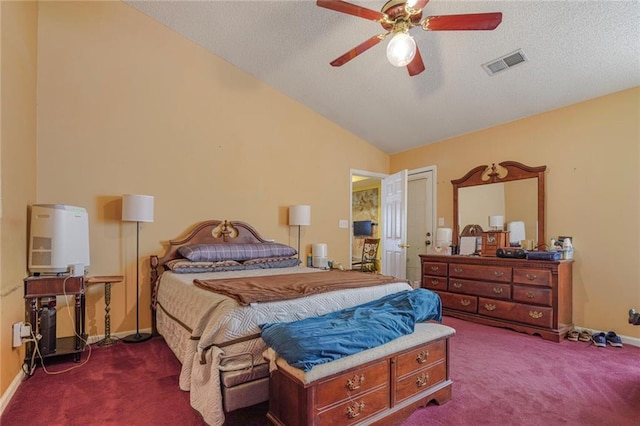 bedroom featuring carpet, visible vents, vaulted ceiling, and a textured ceiling