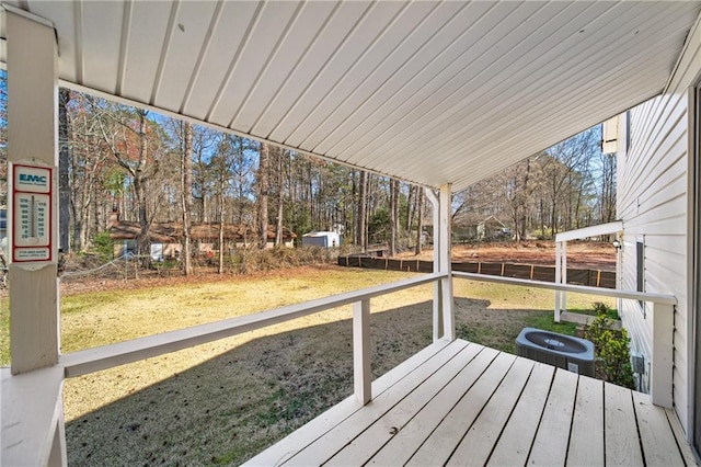 wooden deck with a yard