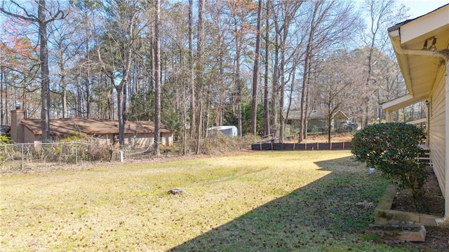 view of yard with fence