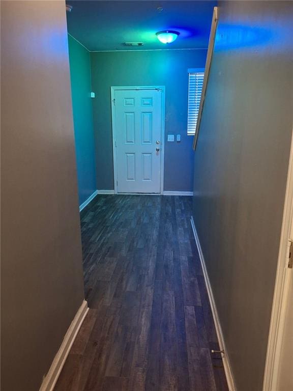 corridor with dark hardwood / wood-style floors