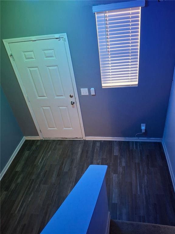 doorway with dark hardwood / wood-style flooring