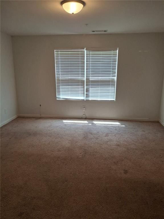 unfurnished room with carpet flooring