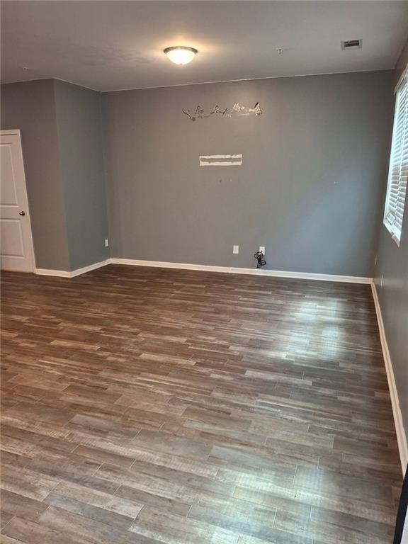 empty room featuring hardwood / wood-style floors