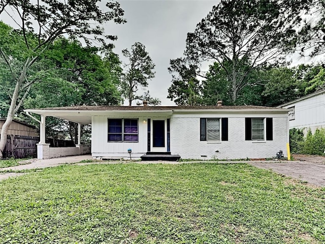 908 Kennesaw Dr, Forest Park, GA 30297 - view of front of home with a front lawn, an attached carport, and brick siding