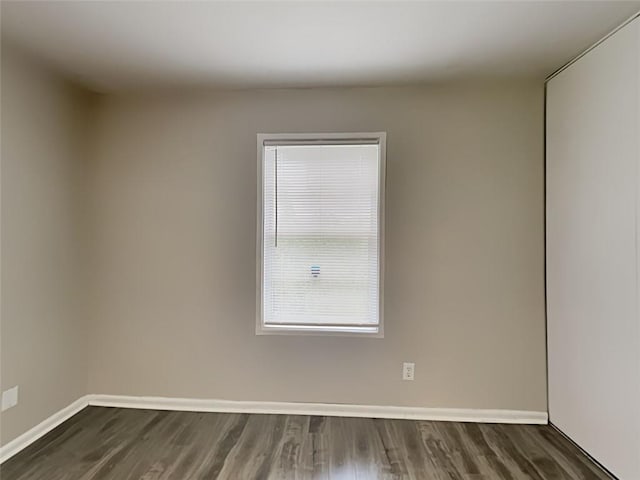 908 Kennesaw Dr, Forest Park, GA 30297 - unfurnished room featuring baseboards and dark wood-type flooring