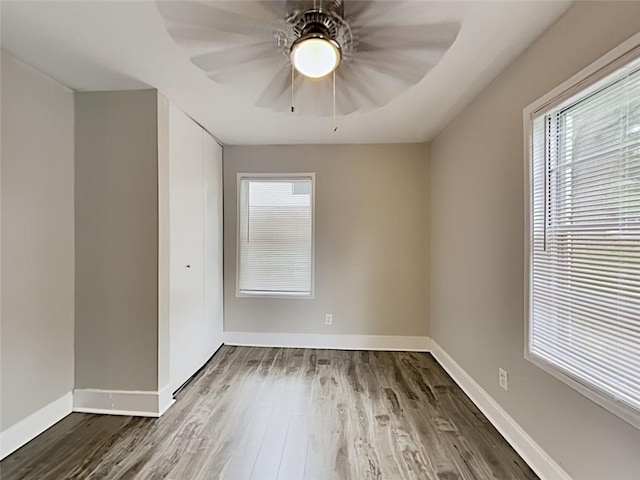 908 Kennesaw Dr, Forest Park, GA 30297 - unfurnished room with wood finished floors, plenty of natural light, baseboards, and ceiling fan