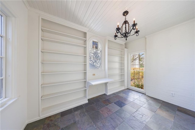 mudroom featuring a notable chandelier, wood ceiling, crown molding, and built in shelves