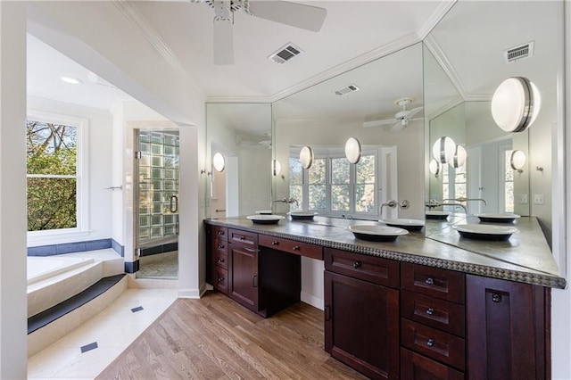 bathroom with vanity, hardwood / wood-style flooring, ceiling fan, and crown molding