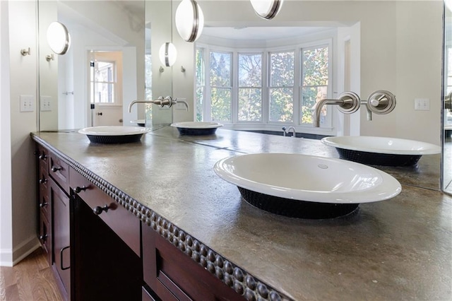 bathroom featuring vanity and hardwood / wood-style flooring