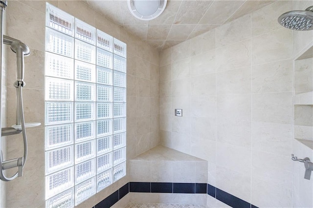 bathroom featuring tiled shower