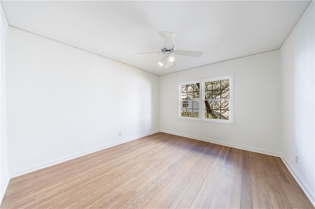 empty room featuring ceiling fan and light hardwood / wood-style floors