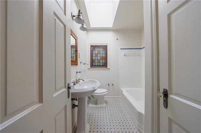 bathroom with shower / bathtub combination, toilet, and a skylight