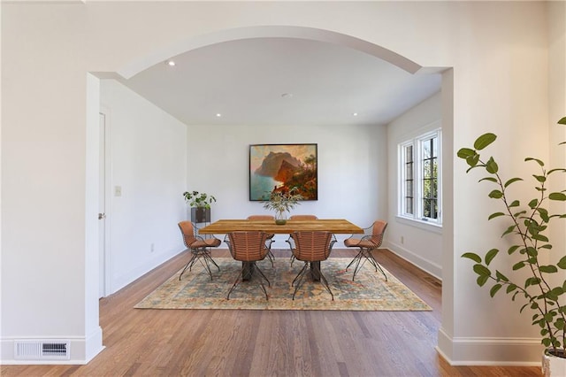 dining area with wood-type flooring