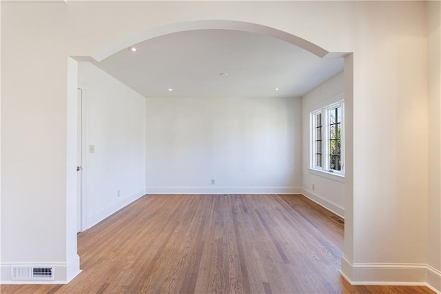 empty room with light hardwood / wood-style flooring