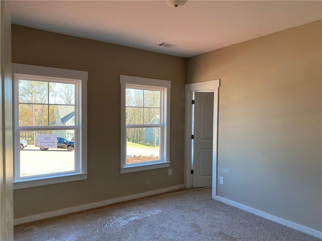 258 Westminster Ct, Winder, GA 30680 - carpeted spare room with plenty of natural light and baseboards