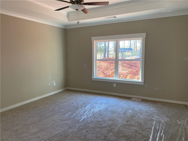 258 Westminster Ct, Winder, GA 30680 - carpeted spare room featuring a raised ceiling, ceiling fan, and baseboards