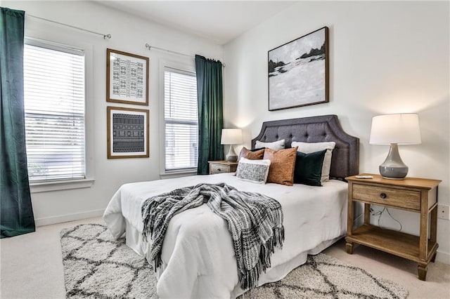 bedroom featuring light carpet