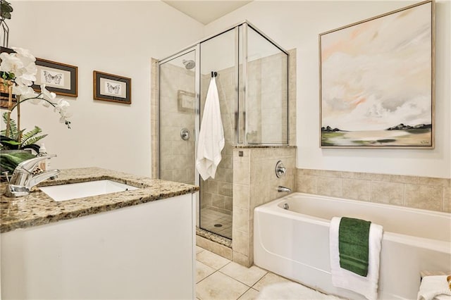 bathroom with vanity, tile patterned floors, and plus walk in shower