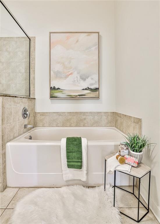 bathroom featuring tile patterned floors and a bathtub