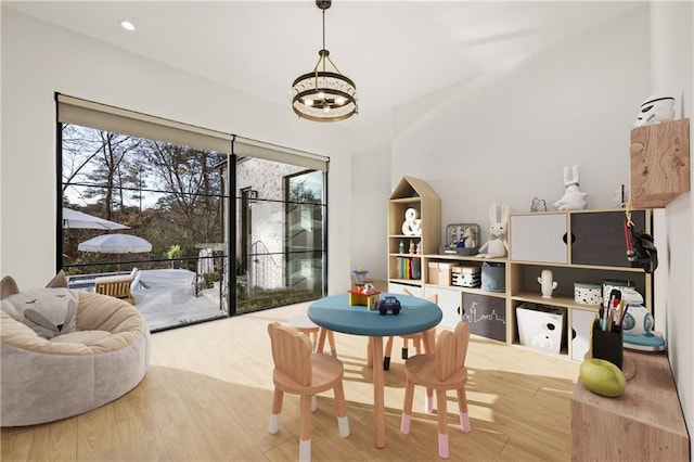 playroom featuring wood finished floors and recessed lighting