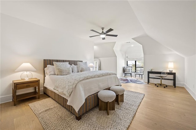 bedroom with lofted ceiling, ceiling fan, light wood-type flooring, and baseboards