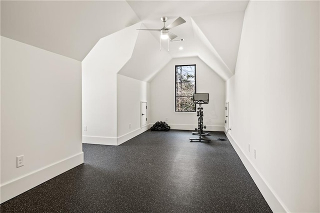 workout area featuring lofted ceiling, visible vents, baseboards, and a ceiling fan