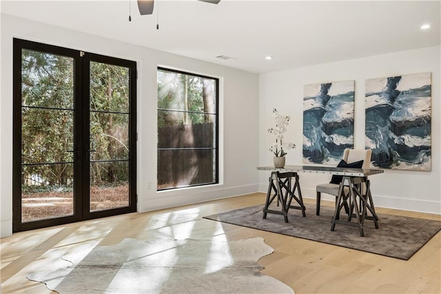 interior space with light wood-style flooring, visible vents, baseboards, and recessed lighting