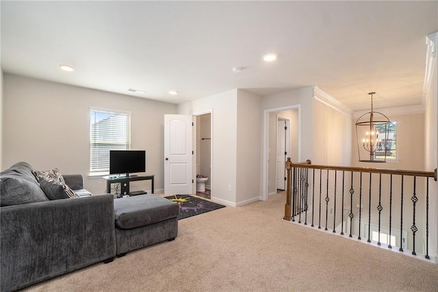 living area with baseboards, recessed lighting, a chandelier, crown molding, and carpet floors