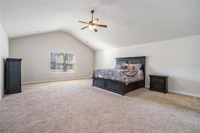 carpeted bedroom featuring ceiling fan, vaulted ceiling, and baseboards