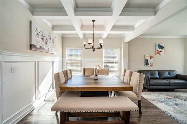 dining room with a notable chandelier, crown molding, beamed ceiling, coffered ceiling, and dark wood-style flooring