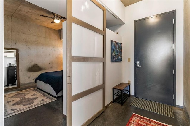 entrance foyer featuring ceiling fan