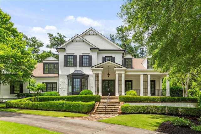 980 Fenimore Cir, Atlanta, GA 30350 - view of front of home featuring french doors, stairway, and a front yard