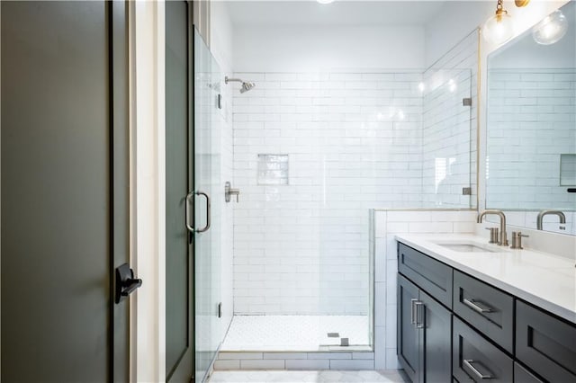 full bathroom featuring vanity and a shower stall