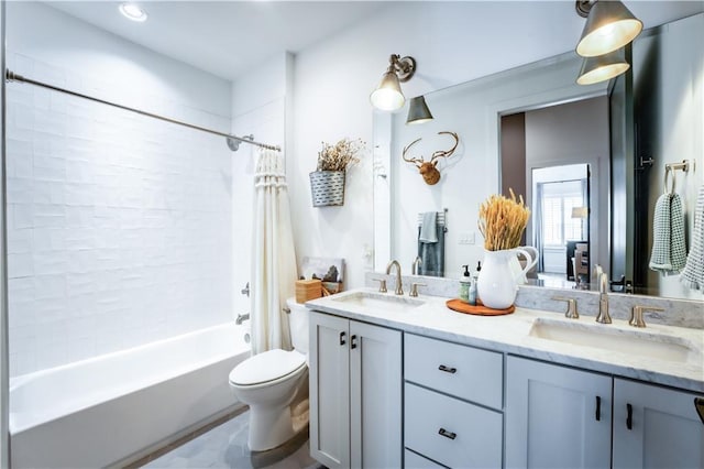 bathroom featuring a sink, shower / bathtub combination with curtain, toilet, and double vanity