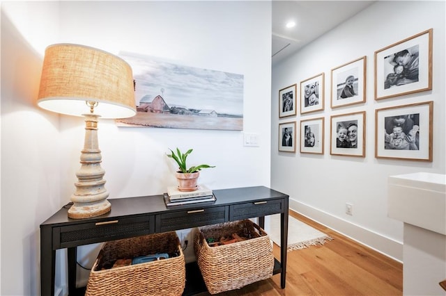 office featuring baseboards and wood finished floors