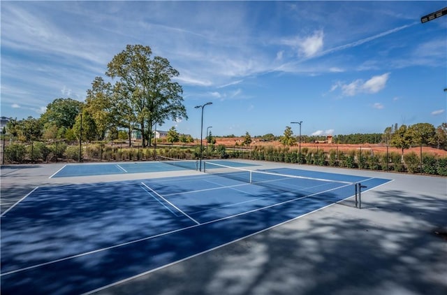 view of sport court featuring community basketball court and fence