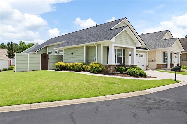 418 Thaxton Ln, Woodstock, GA 30188 - craftsman house featuring an attached garage, a shingled roof, concrete driveway, a gate, and a porch