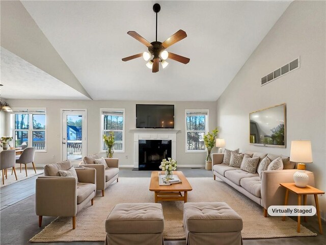 living room featuring high vaulted ceiling and ceiling fan